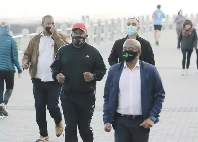  ?? Picture: Gallo Images ?? President Cyril Ramaphosa jogs at the promenade in Sea Point in Cape Town after he concluded his inspection of field hospitals in the city and further afield in the Western Cape.