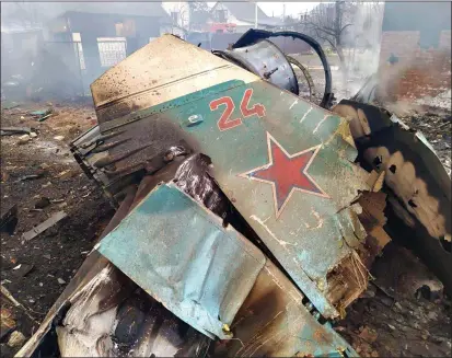  ?? ?? SHOT DOWN: The charred wreckage of a Russian military plane hit by Ukrainian forces in Chernihiv