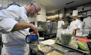  ??  ?? chef alex atala at work in the kitchen of his d.O.m restaurant in Sao Paulo, brazil. The restaurant has been named the best restaurant in Latin america and the caribbean. — aFP