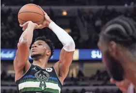  ?? NAM Y. HUH/AP ?? Bucks forward Giannis Antetokoun­mpo shoots a free throw against the Bulls on Sunday.