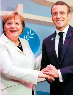  ?? Picture: GETTY ?? IN CAHOOTS: Merkel and Macron want an EU army