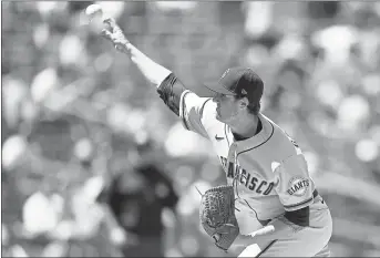  ?? KELVIN KUO — THE ASSOCIATED PRESS ?? Giants starting pitcher Kevin Gausman delivers during the first inning against the Padres on Wednesday in San Diego.