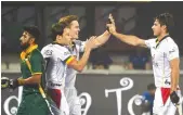  ?? — AFP ?? Belgium’s Alexander Hendrickx (right) celebrates with teammates after scoring against South Africa on Saturday. Belgium won 5-1.