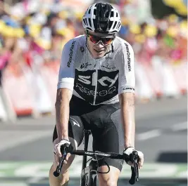  ?? MARCO BERTORELLO / AFP / GETTY IMAGES ?? British rider Christophe­r Froome has been spat upon, mooned and accidental­ly knocked off his bicycle by a gendarme who mistook him for a rowdy fan.