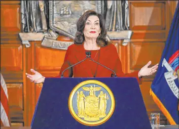  ?? Hans Pennink The Associated Press ?? New York Gov. Kathy Hochul presents her $227 billion executive state budget in the Red Room at the state Capitol on Wednesday in Albany, N.Y.