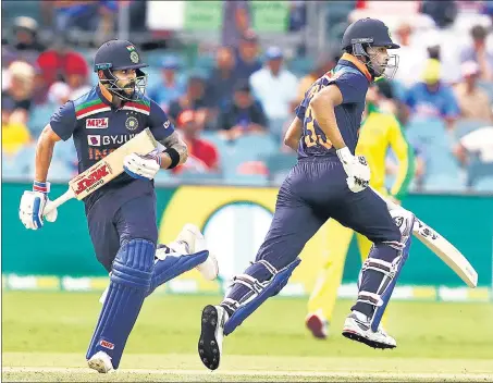  ?? AP ?? Virat Kohli and Hardik Pandya take a single during India’s third ODI against Australia at the Manuka Oval in Canberra on Wednesday. Pandya scored an unbeaten 92.