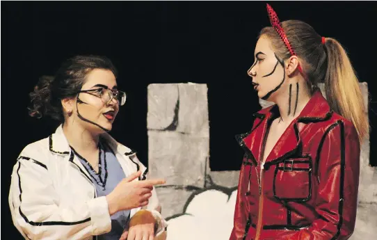  ?? PHOTOS: NICOLE WILLIAMS ?? Olivia Kingston as Doctor, left, and Emily De Smedt as Devil 2 in Cairine Wilson Secondary School’s Cappies production of The Brothers Grimm Spectacula­thon.