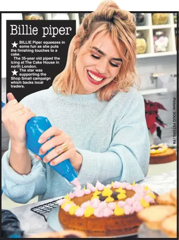  ??  ?? BILLIE Piper squeezes in some fun as she puts the finishing touches to a cake.
The 35-year old piped the icing at The Cake House in north London. The star was supporting the Shop Small campaign which backs local traders.