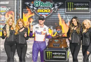  ?? Randy Holt / Associated Press ?? Driver Denny Hamlin, center, celebrates in victory lane after winning a NASCAR Cup auto race at Texas Motor Speedway, Sunday, in Fort Worth, Texas.