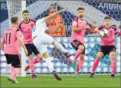  ?? Picture: RADOVAN STOKLASA ?? MAK MY DAY: Robert Mak sends a right-foot shot through the Scottish defence to put Slovakia ahead