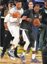  ?? Scott Strazzante / The Chronicle ?? Team LeBron’s Russell Westbrook (left) and Kevin Durant, adversarie­s of late, joke around before the NBA All-Star Game at Staples Center in Los Angeles.