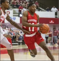  ?? (NWA Democrat-Gazette/Ben Goff) ?? Arkansas guard JD Notae (right) is making the most of his time while back home in Covington, Ga. Notae has a day-by-day training and workout plan to try to improve his game.