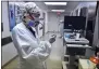  ?? BOB SELF — THE FLORIDA TIMESUNION VIA AP ?? Wearing layers of protective gear, RN Taylor Perri prepares her equipment tray for the next patient as she works in the COVID-19ward at UF Health’s downtown in Jacksonvil­le, Fla., campus Friday, July 30. The second surge of COVID-19 infections in Jacksonvil­le is stretching the capacity of area medical facilities to care for patients.