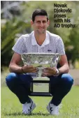 ??  ?? Novak Djokovic poses with his AO trophy.