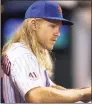  ?? Rich Schultz / TNS ?? Noah Syndergaar­d of the New York Mets looks on from the dugout during the second game of a doublehead­er against the Pittsburgh Pirates at Citi Field in New York.