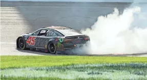  ?? AMY KONTRAS/USA TODAY SPORTS ?? Kurt Busch does a burnout after winning the AdventHeal­th 400 last Sunday at Kansas Speedway.