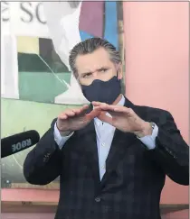  ?? JEFF CHIU — THE ASSOCIATED PRESS ?? Gov. Gavin Newsom wears a protective mask at Miss Ollie’s restaurant in Oakland on June 9. Newsom’s own unforced errors during the pandemic have led to the campaign to recall him.