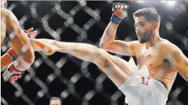  ?? ERIK VERDUZCO/ LAS VEGAS REVIEW-JOURNAL FOLLOW @ERIK_VERDUZCO ?? Carlos Condit, shown during a loss to Robbie Lawler on Jan. 2, will try to stay on his feet against Demian Maia in Saturday’s UFC on Fox 21 event in Vancouver, British Columbia.