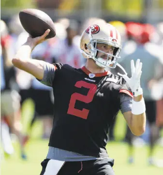  ?? Marcio Jose Sanchez / Associated Press ?? Brian Hoyer, seen by many as a placeholde­r quarterbac­k until Washington’s Kirk Cousins or a high draft pick is available next season, throws Friday at 49ers training camp in Santa Clara.