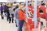  ?? ASSOCIATED PRESS ?? Ally Belden, center, returns an item at Target in Summit Township, Pa., in this file photo. After a busy shopping season, holiday returns inevitably come next. Prepare yourself.