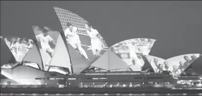  ?? (REUTERS/Loren Elliott) ?? The Sydney Opera House lighted up yesterday in celebratio­n of Australia and New Zealand’s joint bid to host the FIFA Women’s World Cup 2023.