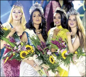  ?? RUSSELL PALMA ?? MISS EARTH: Newly crowned Miss Earth 2019 Nellys Pimentel of Puerto Rico (2nd from left) joins finalists (from left) Miss Earth Fire Alisa Manenok of Belarus, Miss Earth Air Emanii Davis of USA and Miss Earth Water Klara Vavruskova of the Czech Republic during coronation night at Okada Manila yesterday.