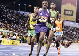  ??  ?? Athletes competing in the boys’ 5,000m open event at the ISSA/GraceKenne­dy Boys and Girls’ Athletics Championsh­ips at the National Stadium on Saturday, March 24, 2018.