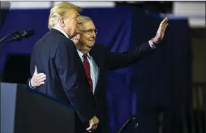  ?? The New York Times/AL DRAGO ?? Senate Majority Leader Mitch McConnell and President Donald Trump attend a rally Saturday in Richmond, Ky. McConnell said Tuesday that “entitlemen­t changes” were “the real driver” of the rising budget deficit and could only be contained if the Democrats controlled at least one chamber of Congress.