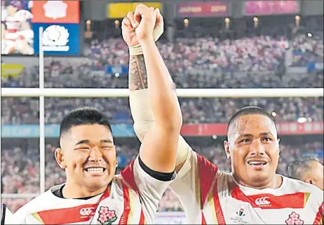  ?? Picture: JAPAN TIMES ?? Japan props Koo Ji-won (L) and Asaeli Ai Valu celebrate after beating Scotland at the Internatio­nal Stadium Yokohama in Yokohama on Sunday.