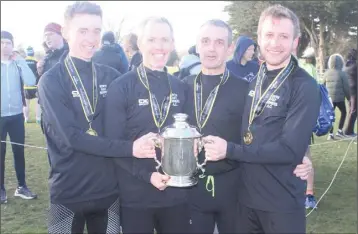  ??  ?? The winning NER team receive the Noel McGuill Cup.