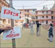  ?? REUTERS ?? Officials from the election commission work to set up polling station a day ahead of the general elections, in Bhaktapur.
