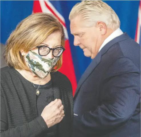  ?? Frank Gunn / THE CANADIAN PRESS ?? Ontario Associate Medical Officer of Health Dr. Barbara Jaffe walks to the podium to speak after Premier Doug Ford at the daily briefing at Queen’s Park on Friday. Ford says projection­s for new COVID-19 cases in Ontario are “scary.”