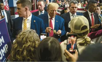  ?? ?? Donald Trump greets supporters in Iowa, which holds its caucuses Jan. 15.