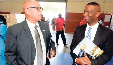  ?? CONTRIBUTE­D ?? Steve Distant (left), chief of retail sales, JN Bank, in discussion with Dr Asburn Pinnock, president of The Mico University College, during a recent orientatio­n exercise at the Marescaux Road institutio­n.