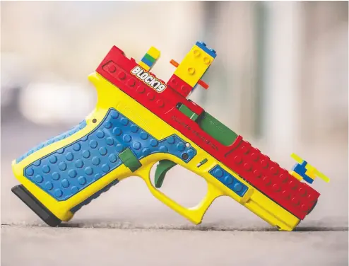  ?? CULPER PRECISION ?? This Glock handgun was customized by Culper Precision to model the appearance of Lego building blocks.