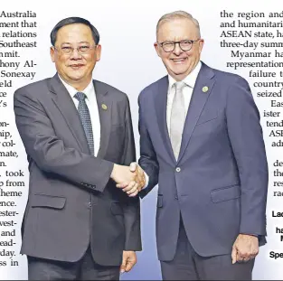  ?? AP ?? Laos Prime Minister Sonexay Siphandone (left) shakes hands with Australian Prime Minister Anthony Albanese at the Asean-Australia Special Summit in Melbourne, Australia on Tuesday.
