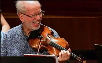  ?? ATTILA KISBENEDEK — AFP VIA GETTY IMAGES ?? Latvian classical violinist, artistic director and founder of Kremerata Baltica, Gidon Kremer performs with his orchestra in the concert hall of Liszt Academy in Budapest on May 19, 2017.