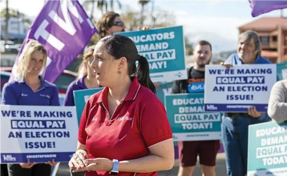  ?? Photo: Kevin Farmer ?? BETTER PAY: Early childhood educator Kate Currie joins Toowoomba childcare workers at a protest calling for better wages.