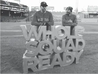  ?? ELISE AMENDOLA/THE ASSOCIATED PRESS ?? Boston Red Sox sluggers J.D. Martinez, left, and Mookie Betts are ready to go as the sign says for what promises to be a vintage World Series against the Los Angeles Dodgers.