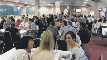  ??  ?? HEALTHY COMPETITIO­N: Dozens of people took part in a quiz to raise money for a Halifax charity