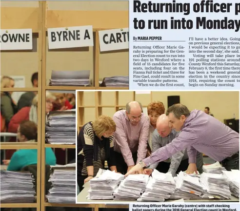  ??  ?? Returning Officer Marie Garahy (centre) with staff checking ballot papers during the 2016 General Election count in Wexford.