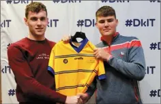  ??  ?? Martin McEneaney receives the goalkeeper’s jersey from Niall Kearns.