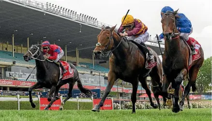  ?? GETTY ?? State Of Rest, centre, wins the $5.4 million Cox Plate from Anamoe, right, and Verry Elleegant in third.