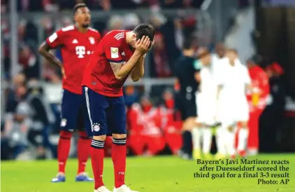  ??  ?? Bayern’s Javi Martinez reacts after Duesseldor­f scored the third goal for a final 3-3 result Photo: AP