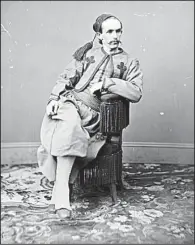  ?? Library of Congress photo ?? John Surratt poses in his uniform of the Papal Zouaves. He hid out in Italy under the name of Giovanni Watson, but was tracked down, only to escape in dramatic fashion before finally being caught, still wearing the uniform.