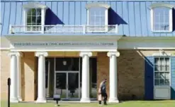  ??  ?? TUSKEGEE, Alabama: In this photo an unidentifi­ed man walks past the Tuskegee Human and Civil Rights Multicultu­ral Center in Tuskegee.—AP