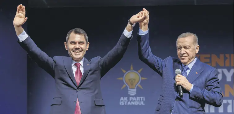  ?? ?? President Recep Tayyip Erdoğan (R) and Murat Kurum, mayoral candidate of the ruling Justice and Developmen­t Party (AK Party), greet their supporters during a rally ahead of the local elections in Istanbul, Türkiye, March 24, 2024.