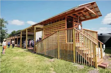  ?? Photos by Brett Coomer/Staff photograph­er ?? A composting bathroom is shown during a “Flip the Switch” to solar ceremony at Hope Farms’ new Sun Club Sustainabi­lity Plaza on Tuesday. The bathroom is powered by renewable electricit­y.