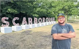  ?? AARON D'ANDREA/METROLAND ?? Derek Spooner, director of Scarboroug­h Arts, which produced the sign, says “We want to show ... there’s really great art here, programmin­g, people, things to see ... and reasons to come out here.”