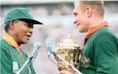  ??  ?? NELSON Mandela with then Springbok captain Francois Pienaar after SA’s 1995 World Cup victory at Ellis Park.